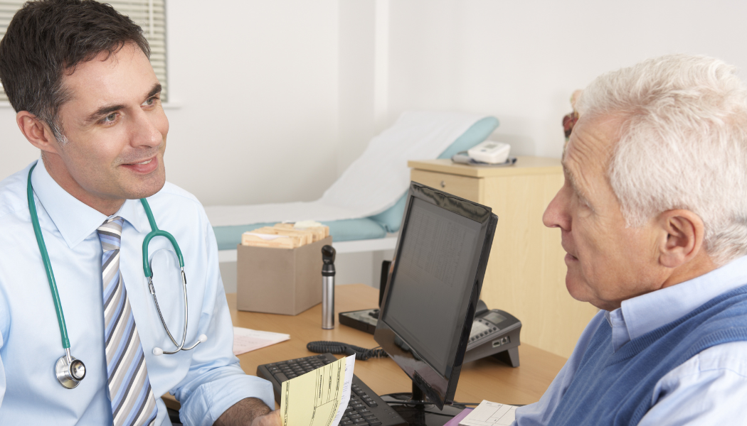 Male doctor and male patient talking 